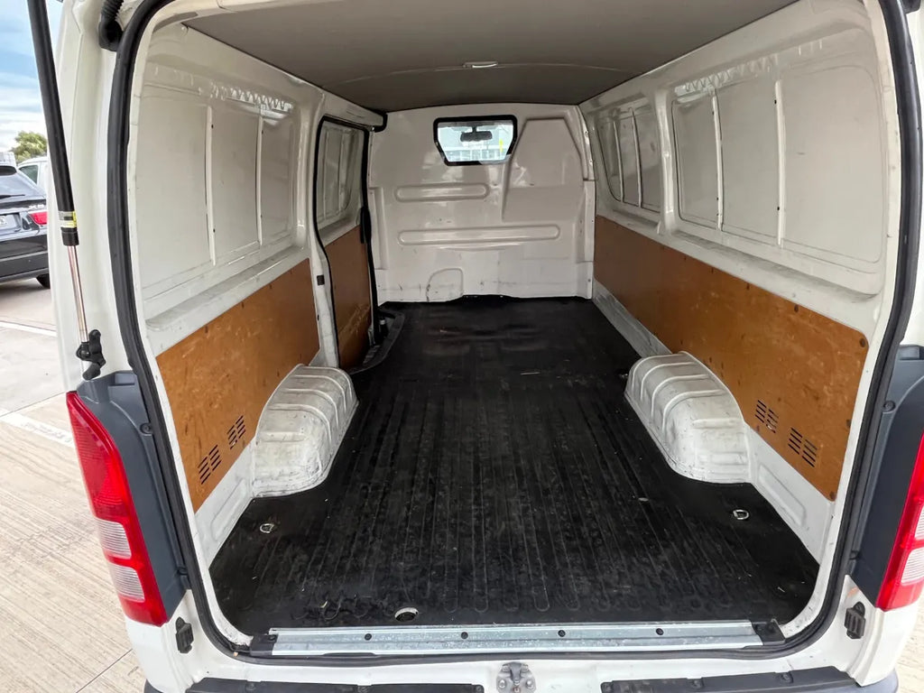 Van interior with wooden paneling on the sides