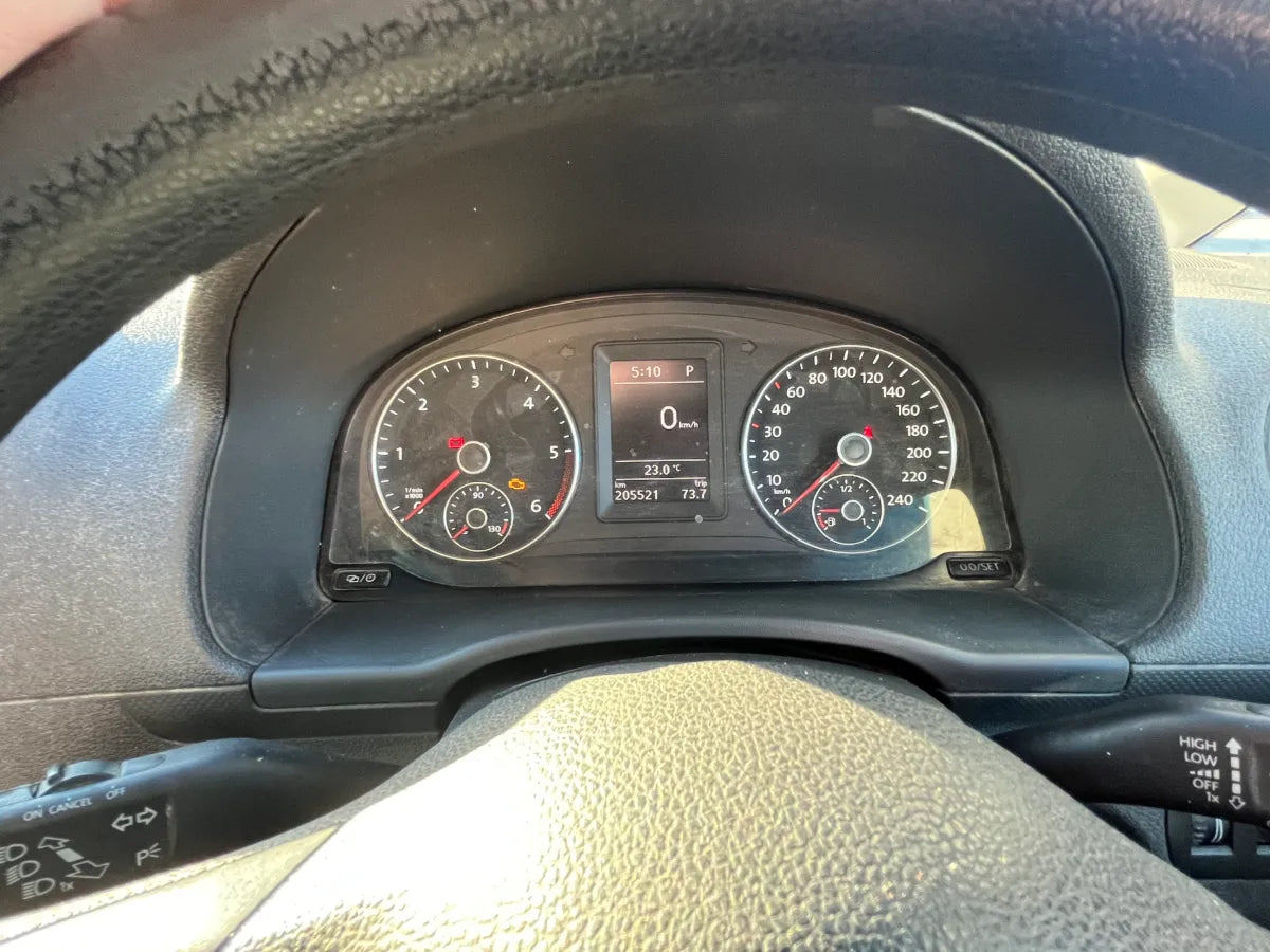 Car dashboard with steering wheel and digital display