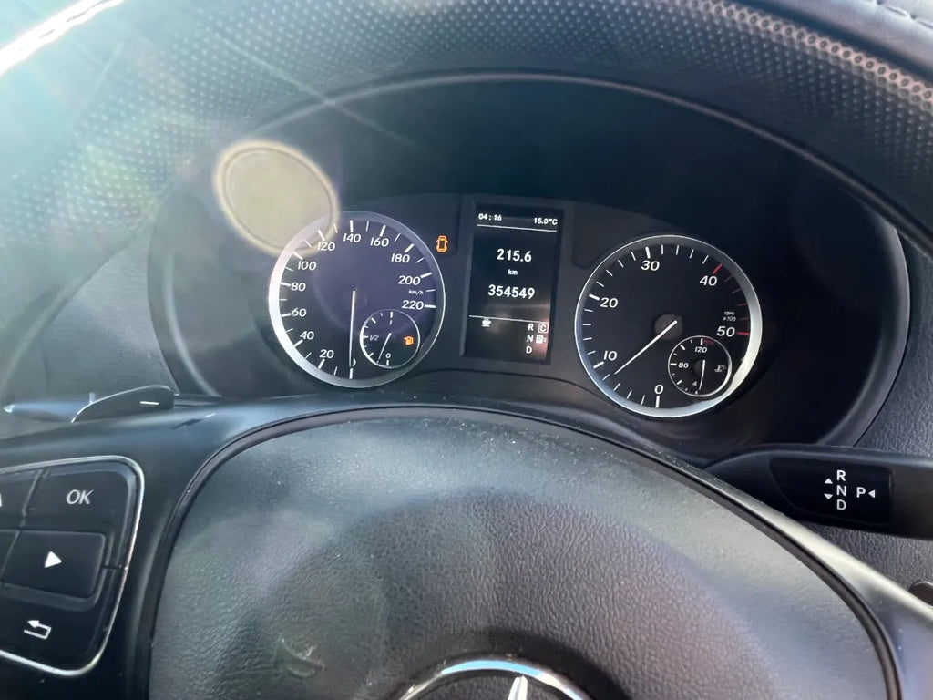 Car dashboard with digital and analog gauges