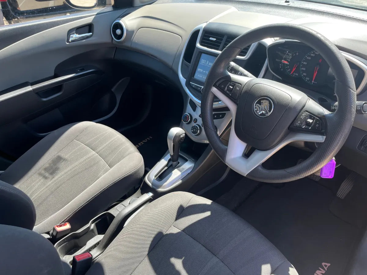 Car interior with steering wheel and dashboard view